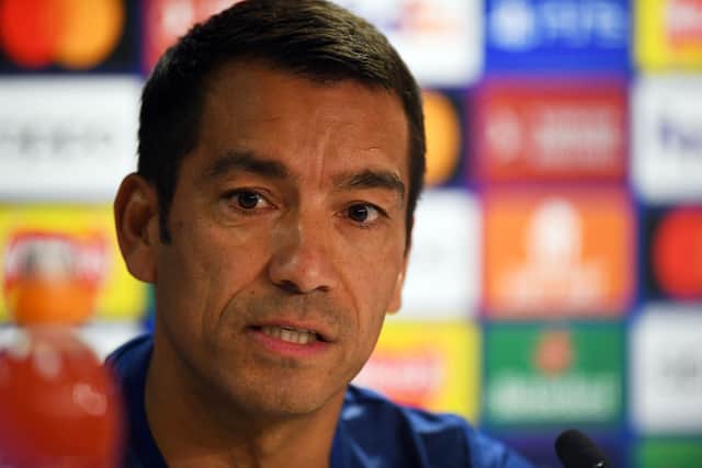 Giovanni van Bronckhorst speaks during a press conference on the eve of the UEFA Champions League group A football match between Scotland's Rangers and Italy's Napoli at the Ibrox Stadium