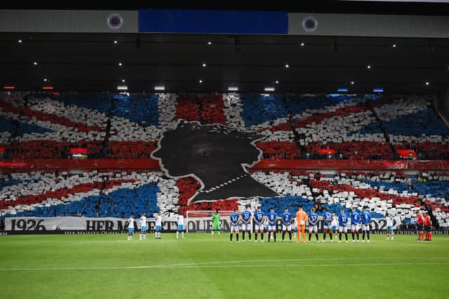 Rangers’ and Napoli’s player observe a minute’s silence to mark the death of Britain’s Queen Elizabeth II ahead of the UEFA Champions League Group A tie