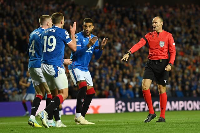 Referee, Antonio Mateu Lahoz awards a penalty to SSC Napoli as John Lundstram, James Sands and Connor Goldson of Rangers react 