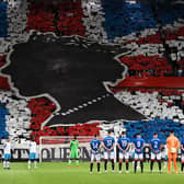 Rangers’ and Napoli’s player observe a minute’s silence to mark the death of Britain’s Queen Elizabeth II ahead of the UEFA Champions League Group A football match between Scotland’s Rangers and Italy’s Napoli at Ibrox stadium in Glasgow, on September 14, 2022. (Photo by ANDY BUCHANAN / AFP) (Photo by ANDY BUCHANAN/AFP via Getty Images)