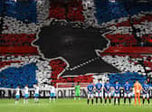 Rangers’ and Napoli’s player observe a minute’s silence to mark the death of Britain’s Queen Elizabeth II ahead of the UEFA Champions League Group A football match between Scotland’s Rangers and Italy’s Napoli at Ibrox stadium in Glasgow, on September 14, 2022. (Photo by ANDY BUCHANAN / AFP) (Photo by ANDY BUCHANAN/AFP via Getty Images)