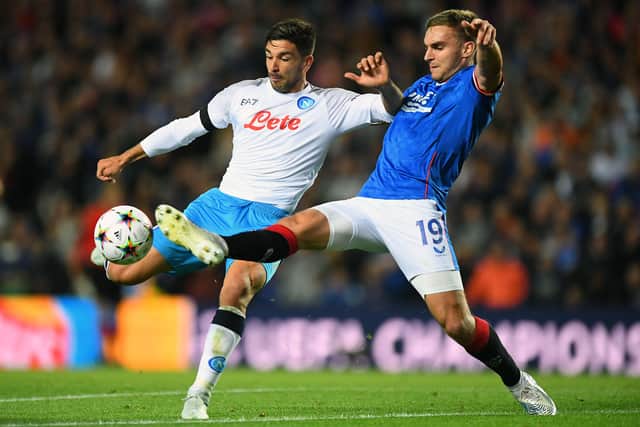 Napoli's Argentinian forward Giovanni Simeone (L) and Rangers' US midfielder James Sands vie for the ball during the UEFA Champions League Group A football match 
