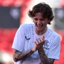 Midfielder Alex Lowry laughs as he takes part in a training session, on the eve of the Europa League final