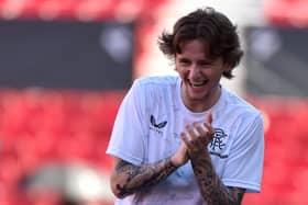 Midfielder Alex Lowry laughs as he takes part in a training session, on the eve of the Europa League final