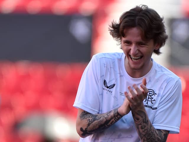 Midfielder Alex Lowry laughs as he takes part in a training session, on the eve of the Europa League final