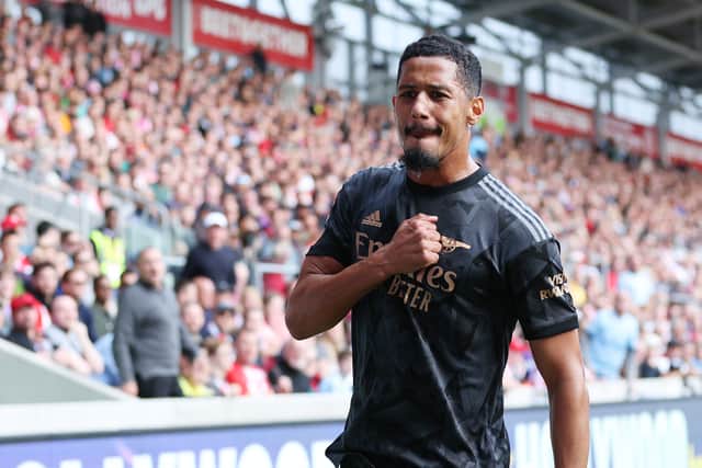 William Saliba of Arsenal celebrates after scoring their side’s first goal during the Premier League match against Brentford FC