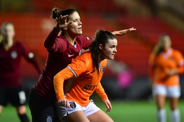 Clare Shine of Glasgow City is challenged by Petra Bertholdova of Sparta Prague during the UEFA Women's Champions League round of 32 second leg match 