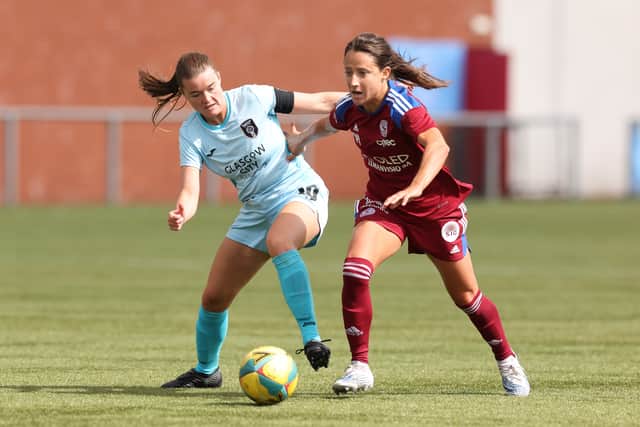 Maeva Clemaron of Servette FCCF is brought down by Clare Shine of Glasgow City during the LP Group 1 Play Off - UEFA Women's Champions League match 