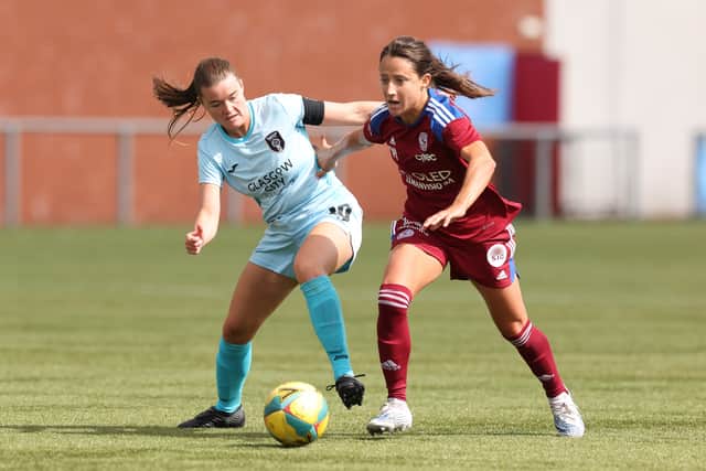 Maeva Clemaron of Servette FCCF is brought down by Clare Shine of Glasgow City during the LP Group 1 Play Off - UEFA Women's Champions League match