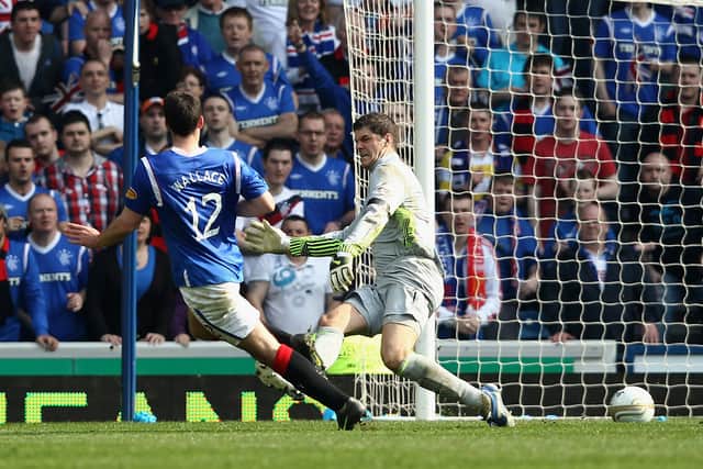 Lee Wallace scores his team’s third goal during the Clydesdale Bank Scottish Premier League match between Rangers and Celtic at Ibrox Stadium on March 25, 2012
