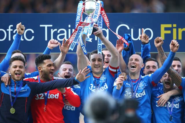 Lee Wallace holds the trophy during the Petrofac Training Cup Final between Rangers and Peterhead at Hampden Park on April 10, 2016