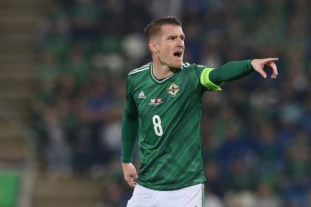 Steven Davis gives instructions to his side during the 2022 FIFA World Cup Qualifier match between Northern Ireland and Switzerland at Windsor Park 