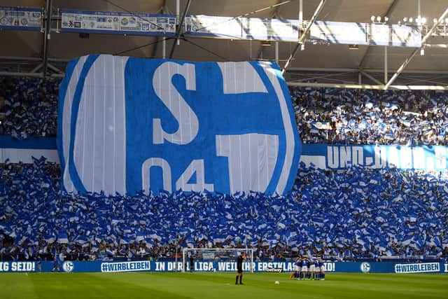 A general view inside the stadium as fans of FC Schalke 04 show their support prior to the Bundesliga match between FC Schalke 04 and Borussia Monchengladbach at Veltins-Arena 