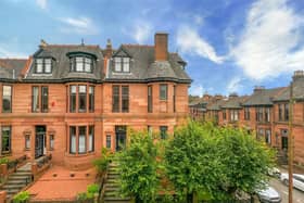 The red sandstone property occupies the corner site on Dowanhill Street.