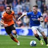 Ryan Kent takes on Liam Smith of Dundee United during the Cinch Scottish Premiership match between Ranger and Dundee United 