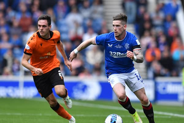 Ryan Kent takes on Liam Smith of Dundee United during the Cinch Scottish Premiership match between Ranger and Dundee United 