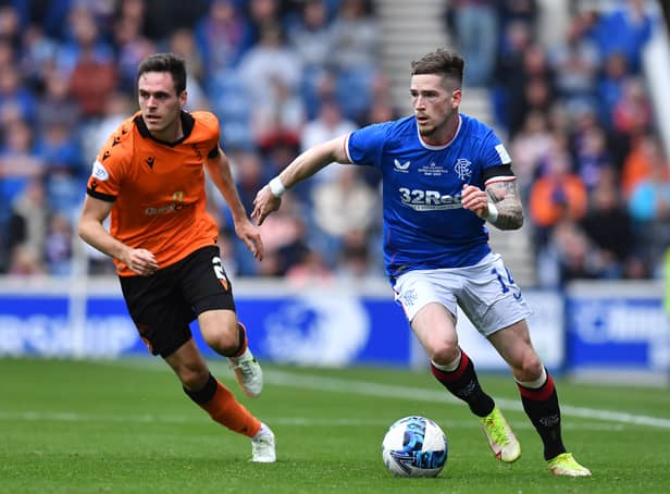 <p>Ryan Kent takes on Liam Smith of Dundee United during the Cinch Scottish Premiership match between Ranger and Dundee United </p>