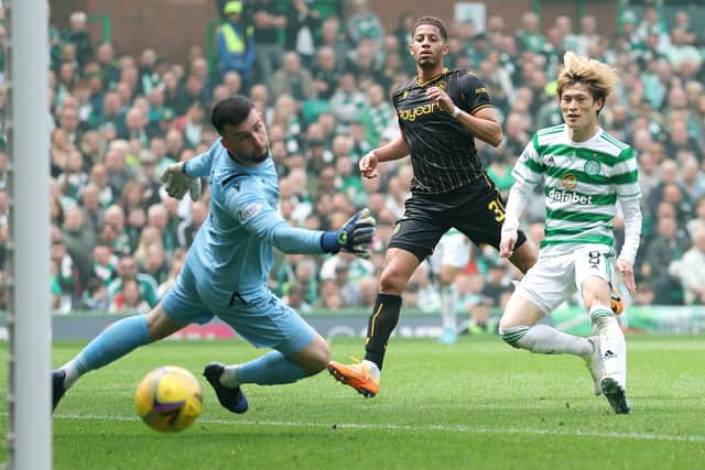 Kyogo Furuhashi scores his side’s third goal during the Cinch Scottish Premiership match between Celtic and Motherwell at Celtic Park on May 14, 2022