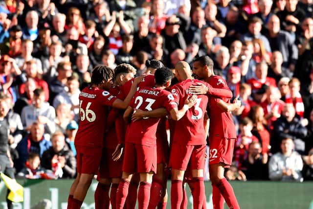 Liverpool FC celebrates after Brighton & Hove Albion score an own goal during the Premier League match between Liverpool and Brighton & Hove Albion at Anfield