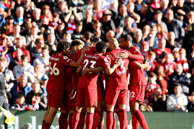 Liverpool FC celebrates after Brighton & Hove Albion score an own goal during the Premier League match between Liverpool and Brighton & Hove Albion at Anfield 