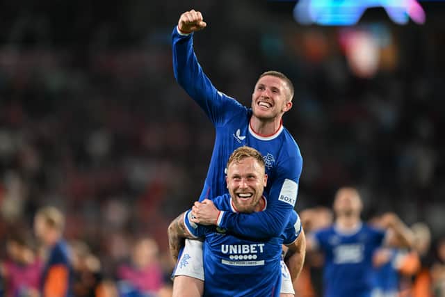 Scott Arfield of Glasgow Rangers celebrates with his teammate John Lundstram of Glasgow Rangers after the UEFA Champions League Play-Off Second Leg match between PSV and Glasgow Rangers at Phillips Stadium