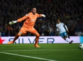 Allan McGregor attempts to stop the ball after saving a penalty that was later invalidated by the VAR and forced to be retaken, during the UEFA Champions League Group A football match between Rangers and Napoli at Ibrox stadium