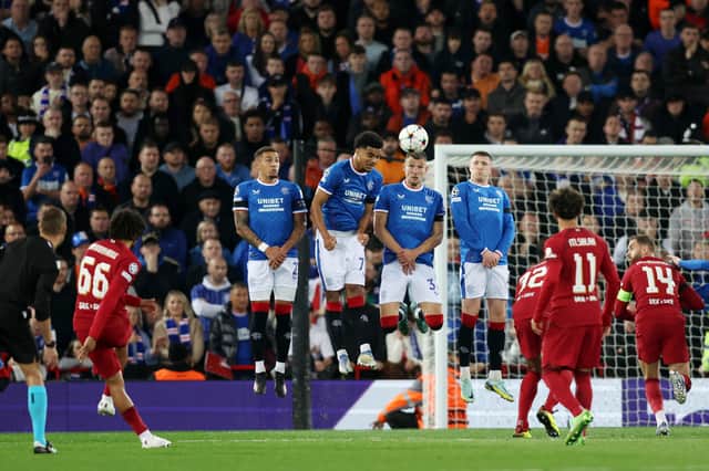 Trent Alexander-Arnold scores their team’s first goal during the UEFA Champions League group A match between Liverpool and Rangers