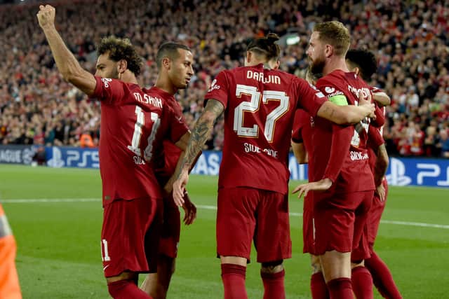 Mohamed Salah celebrates with his Liverpool team mates after scoring the second goal  