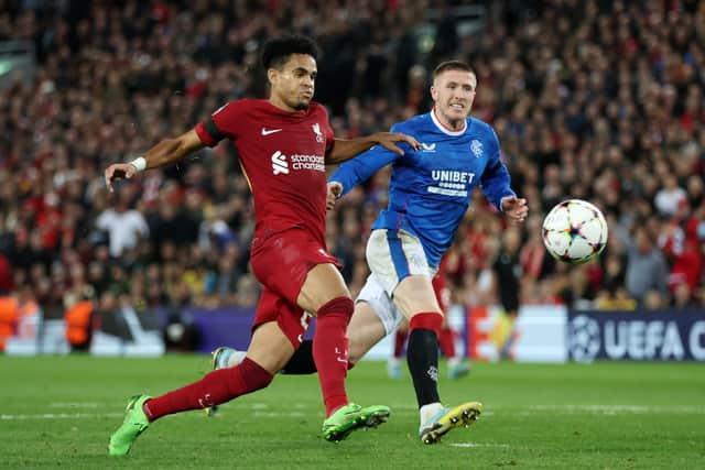 Luis Diaz of Liverpool shoots under pressure from John Lundstram of Rangers 