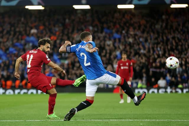  Mohamed Salah of Liverpool shoots under pressure from James Tavernier of Rangers