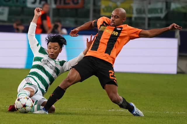 Celtic's Japanese defender Reo Hatate (L) and Shakhtar Donetsk's Brazilian defender Lucas Taylor vie for the ball during UEFA Champions League Group F between Shakhtar Donetsk and Celtic