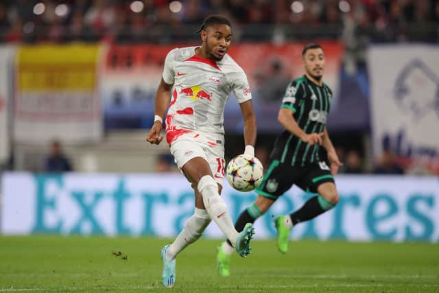 Leipzig's French midfielder Christopher Nkunku scores the opening goal which was then called offside