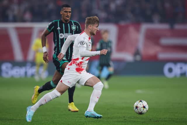 Leipzig's German forward Timo Werner (R) and Celtic's German defender Moritz Jenz vie for the ball