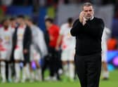 Angelos Postecoglou, Manager of Celtic applauds the fans after their sides defeat