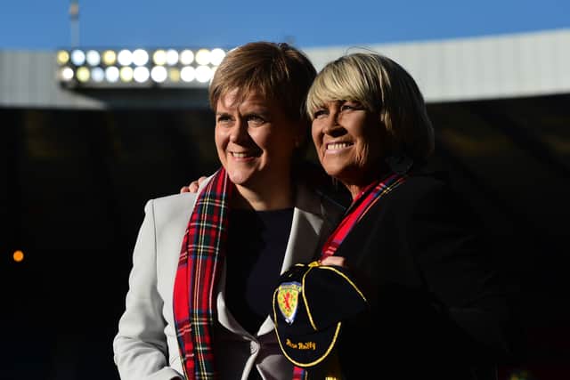 First minister of Scotland Nicola Sturgeon MSP, with ex Scotland player Rose Reilly (R), during the Women’s International Friendly between Scotland and Jamaica at Hampden Park on May 28, 2019