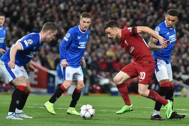 Diogo Jota up against three Rangers players during the UEFA Champions League group A match at Anfield