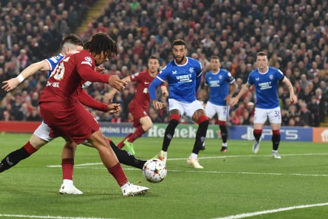Trent Alexander-Arnold of Liverpool is challenged by Ryan Kent of Rangers during the UEFA Champions League group A match