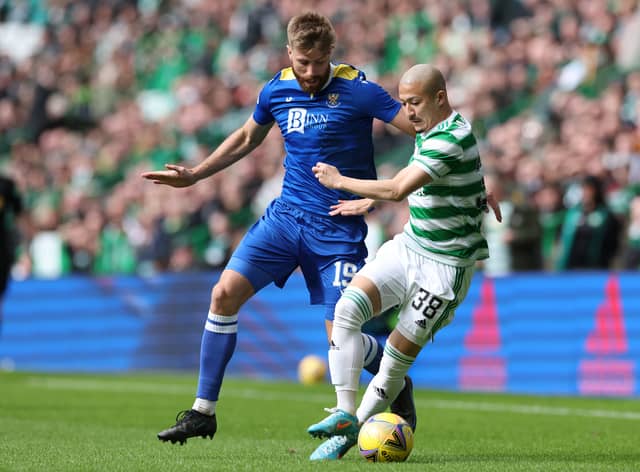 Daizen Maeda of Celtic challenged by Shaun Rooney of St Johnstone during the Cinch Scottish Premiership match