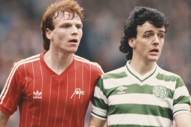 Aberdeen centre half Alex McLeish (l) pictured with Celtic striker Frank McGarvey during a Scottish Premier League match circa 1983