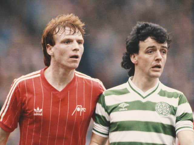 Aberdeen centre half Alex McLeish (l) pictured with Celtic striker Frank McGarvey during a Scottish Premier League match circa 1983