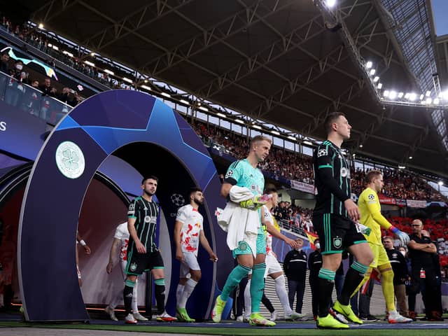 Players of Celtic and Leipzig enter the pitch before the UEFA Champions League Group F football match RB Leipzig v Celtic FC in Leipzig, eastern Germany