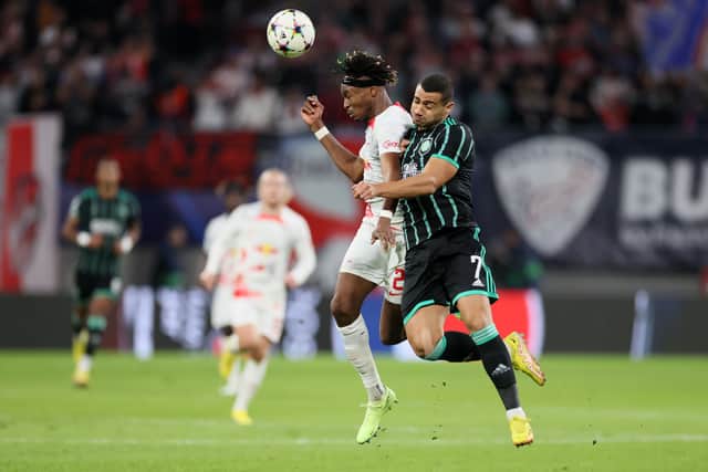 Mohamed Simakan of RB Leipzig jumps for the ball with Giorgos Giakoumakis of Celtic during the UEFA Champions League group F match