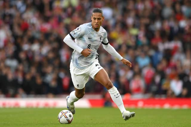 Virgil van Dijk of Liverpool runs with the ball during the Premier League match between Arsenal FC and Liverpool FC at Emirates Stadium