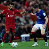 Mohamed Salah is challenged by Leon King during the UEFA Champions League group A match between Liverpool and Rangers (Photo by Clive Brunskill/Getty Images)