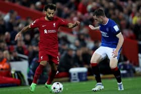 Mohamed Salah is challenged by Leon King during the UEFA Champions League group A match between Liverpool and Rangers (Photo by Clive Brunskill/Getty Images)