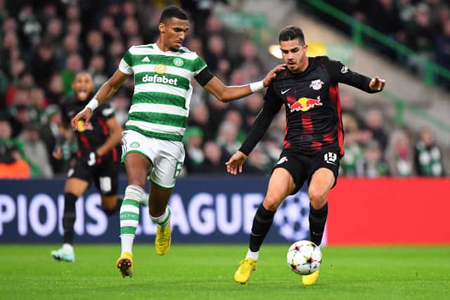 Celtic's German defender Moritz Jenz (L) vies with RB Leipzig's Portuguese striker Andre Silva