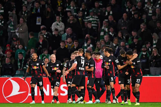 RB Leipzig's Swedish midfielder Emil Forsberg is mobbed by teammates after scoring the team's second goal 