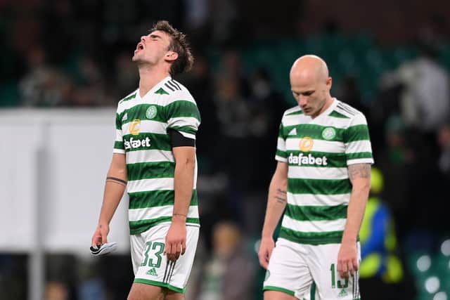 Matt O'Riley and Aaron Mooy of Celtic look dejected following their sides defeat