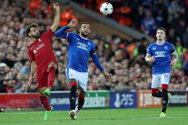 Liverpool's Egyptian striker Mohamed Salah (L) vies for the ball against Rangers' English defender Connor Goldson