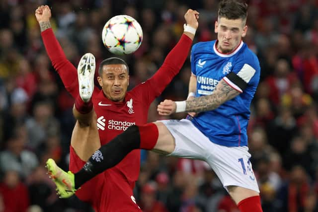 Liverpool's Spanish midfielder Thiago Alcantara (L) vies for the ball against Rangers' English midfielder Ryan Kent